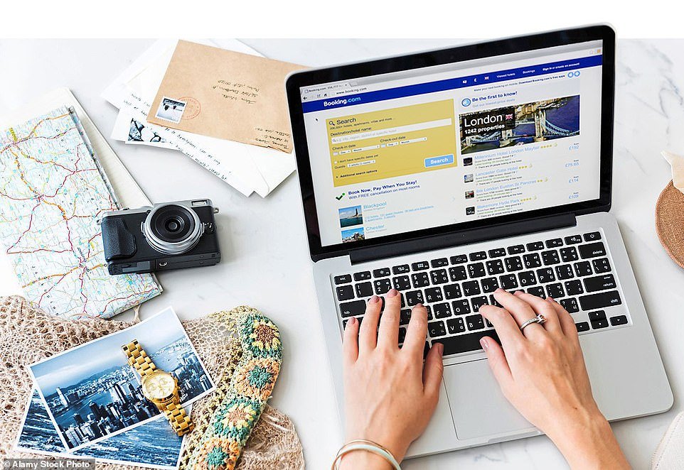 a lady typing on a laptop showing the concept of booking a lodge online