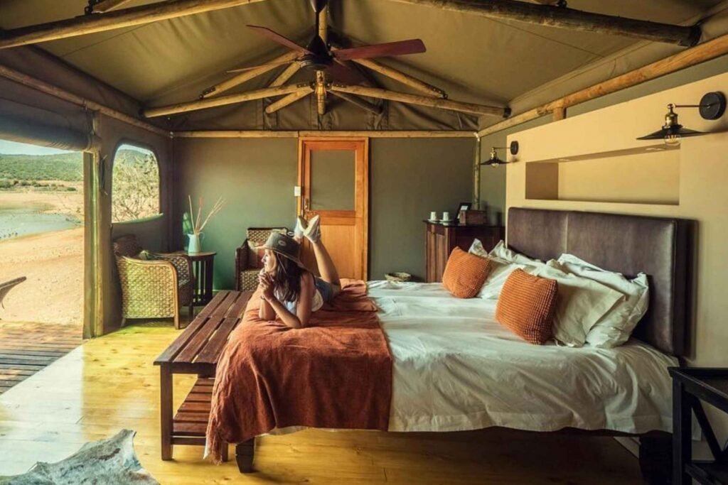 a lady sleeping on the bed at a lodge wildlife safaris 